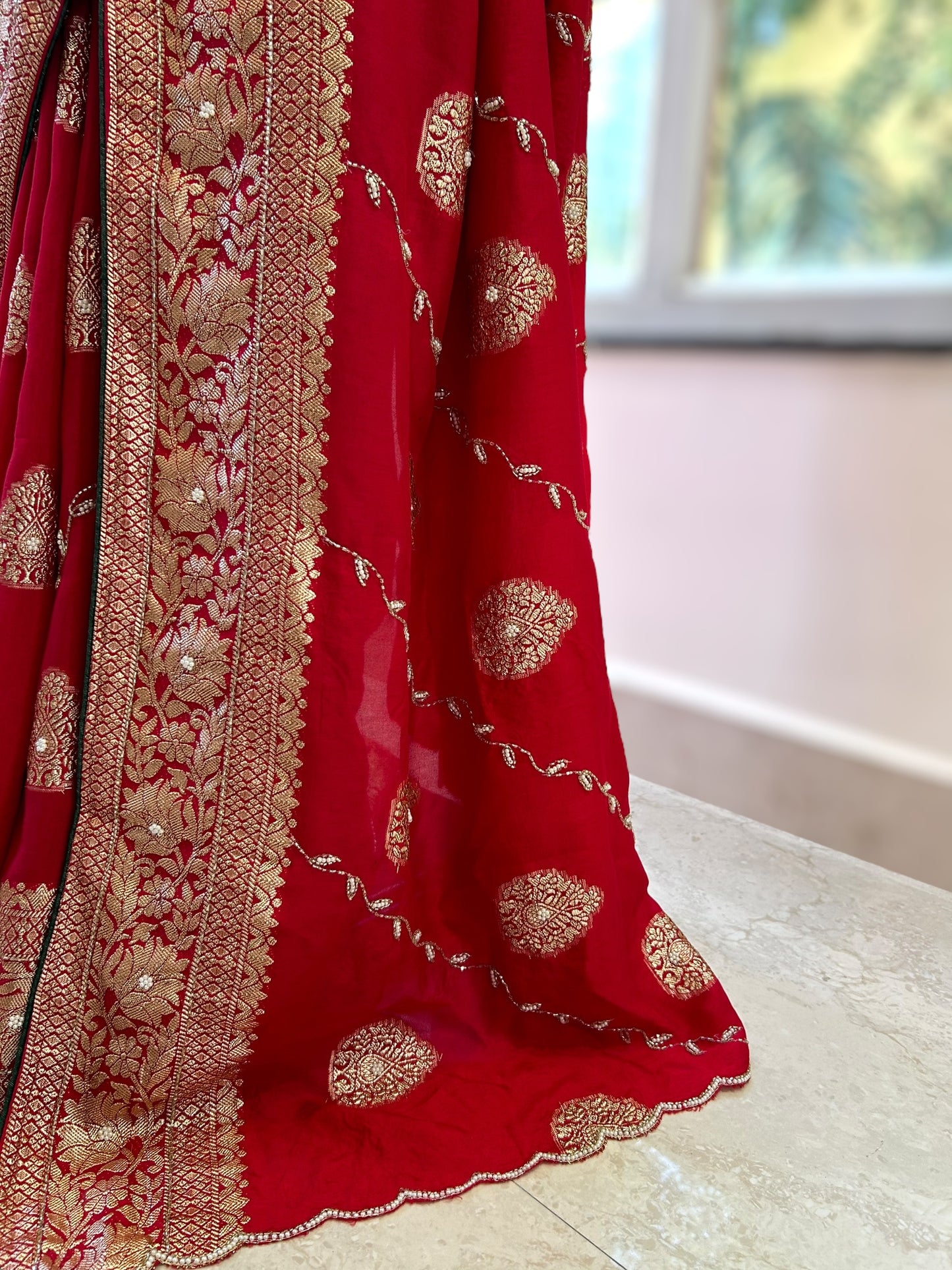 Red pearls embellished saree