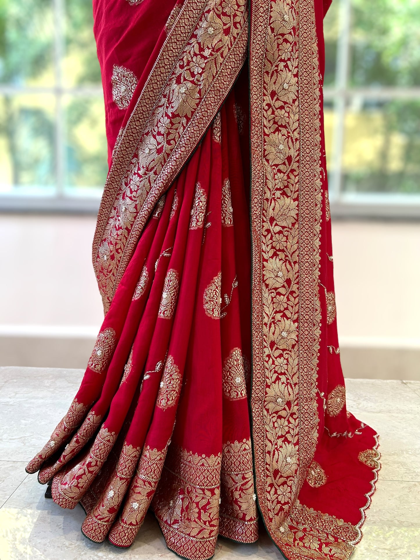 Red pearls embellished saree