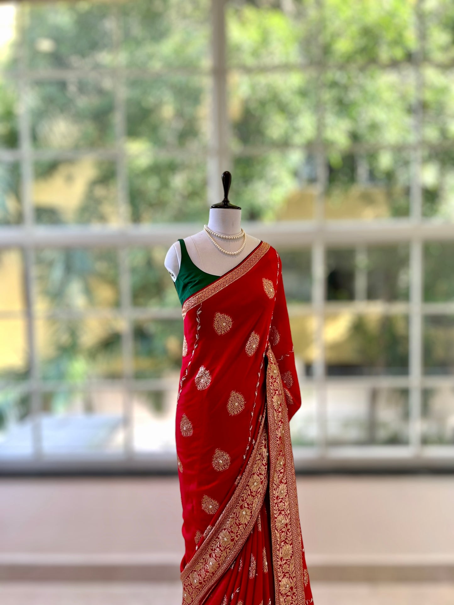 Red pearls embellished saree