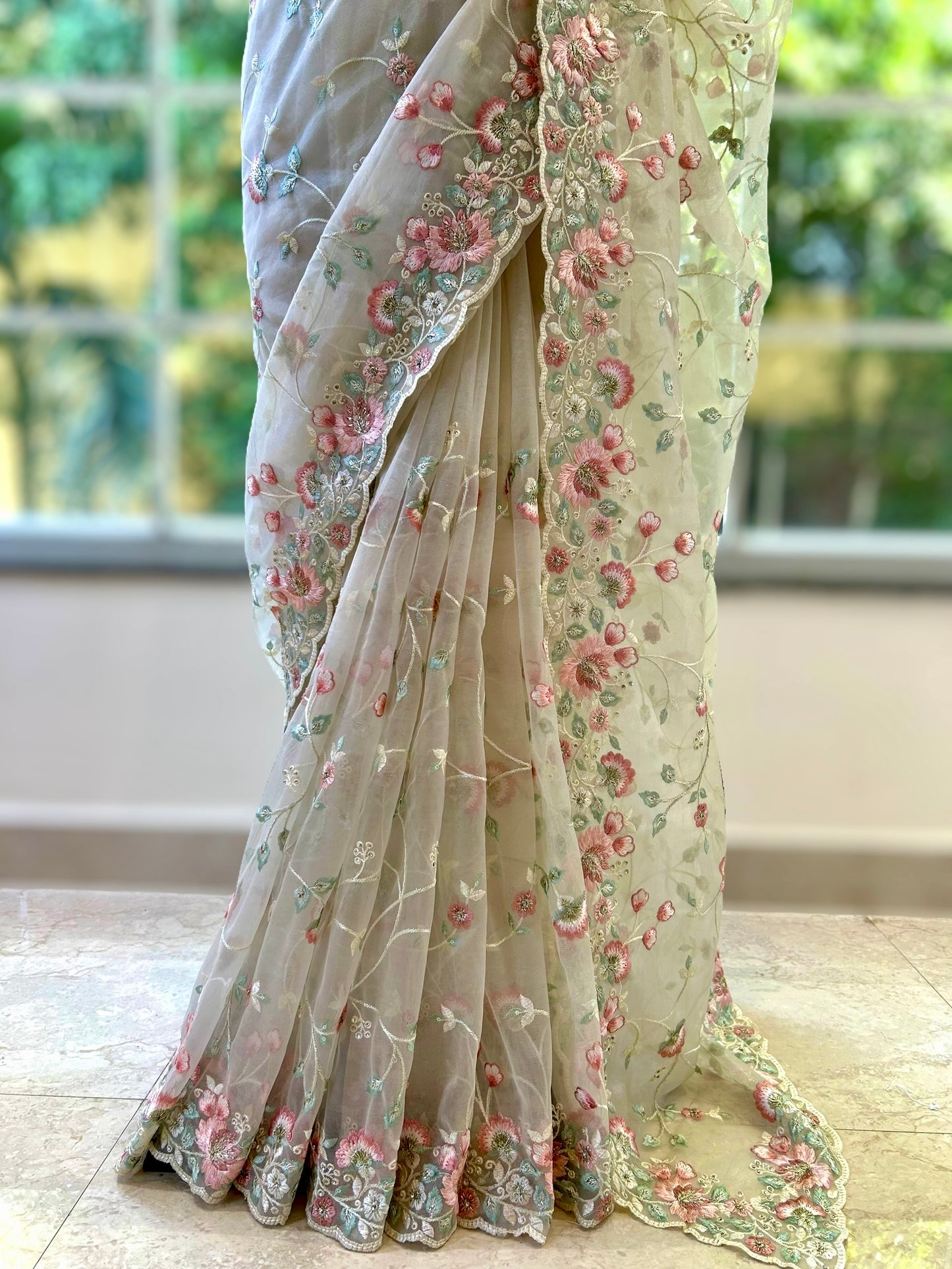 Beige shimmer net embroidered saree