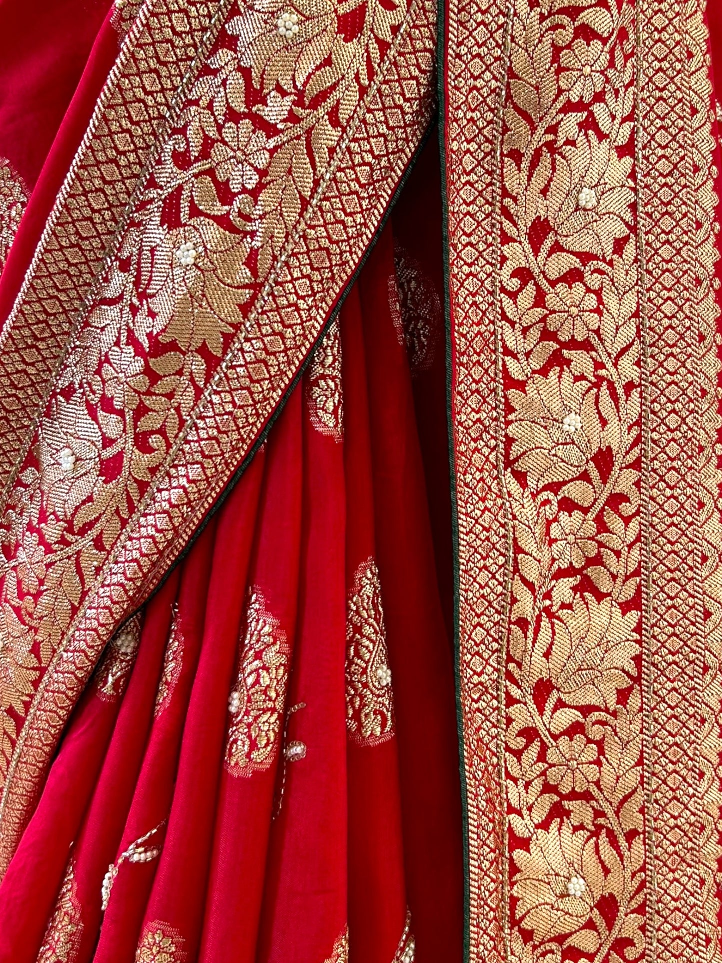 Red pearls embellished saree